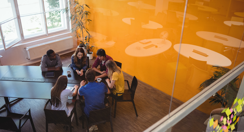 CommerceForz team collaborating in a modern office, engineering integrated enterprise solutions for businesses